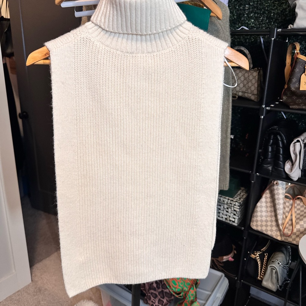 Cream Knit Sleeveless Turtleneck Poncho Top
Size: One Size (fits most)